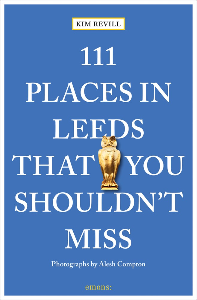 Golden owl sculpture near centre of blue cover of '111 Places in Leeds That You Shouldn't Miss', by Emons Verlag.