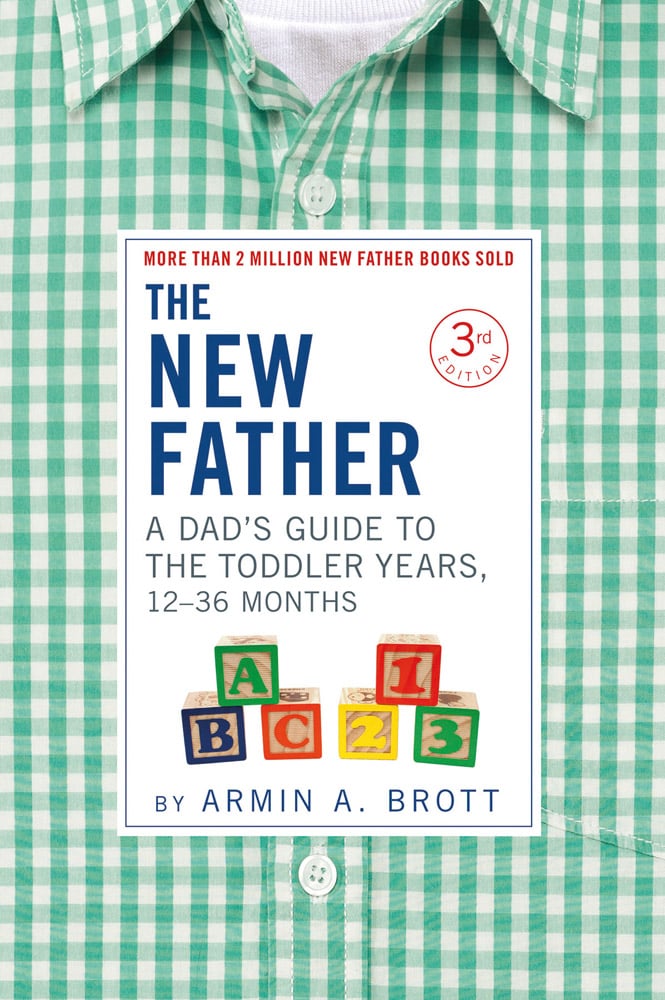 Green and white checked shirt, THE NEW FATHER A DAD'S GUIDE TO THE TODDLER YEARS, 12-36 MONTHS in blue and green font to centre white banner.