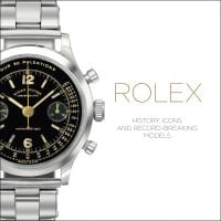 Silver Rolex oyster watch, with black face, on white cover of 'Rolex, History, Icons and Record-Breaking Models', by ACC Art Books.