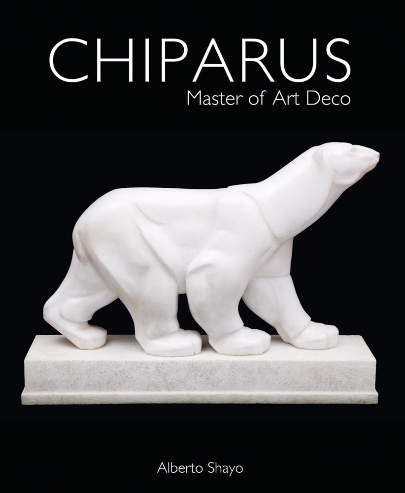 White stone carved sculpture of Polar bear on plinth by Demétre Chiparus, on black cover of 'Chiparus Master of Art Deco Alberto Shayo, by ACC Art Books.