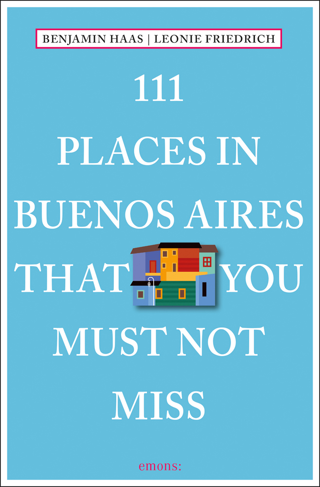 Colourful housing block near centre of blue cover of '111 Places in Buenos Aires That You Must Not Miss', by Emons Verlag.