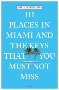 Two tall green palm trees, near center of bright blue cover of '111 Places in Miami and the Keys That You Must Not Miss', by Emons Verlag.