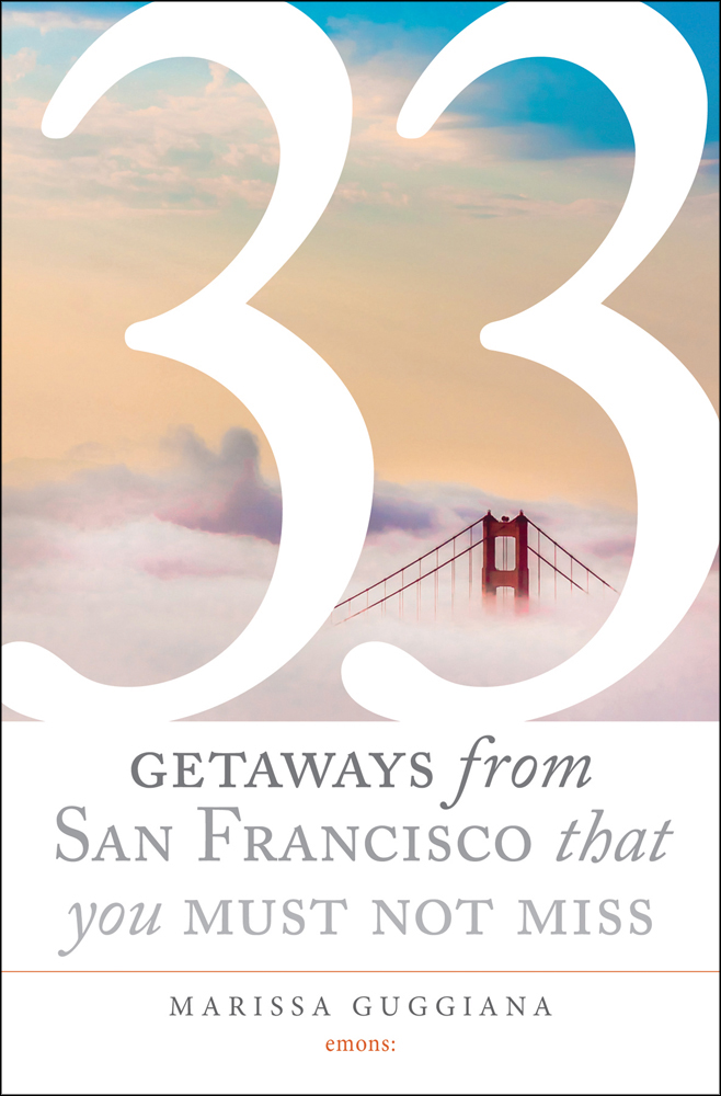 Golden Gate Bridge surrounded by low lying clouds, on cover of '33 Getaways from San Francisco That You Must Not Miss', by Emons Verlag.