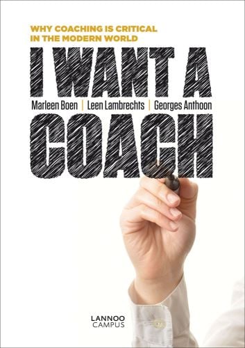 Hand writing with black marker pen, on cover of 'I Want a Coach', by Lannoo Publishers.