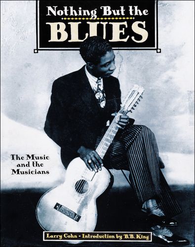 American blues guitarist Jonnie Johnson holding acoustic guitar, Nothing But the BLUES in white, and cream font to top black banner.