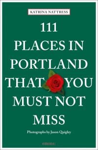 Red rose near centre of green cover of '111 Places in Portland That You Must Not Miss', by Emons Verlag.