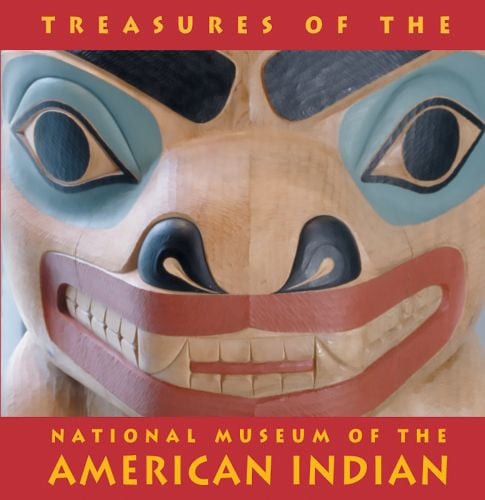 Close up carved cedar totem pole with large eyes and teeth, TREASURES OF THE NATIONAL MUSEUM OF THE AMERICAN INDIAN in yellow font on top and bottom red banners.