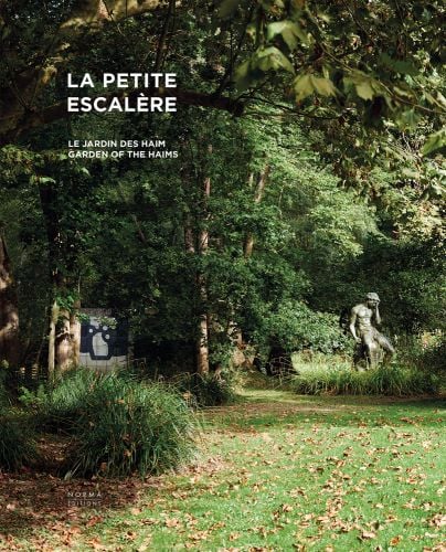 Sculpture of male figure in with hand on face, surrounded by green garden foliage, LA PETITE ESCALÈRE GARDEN OF THE HAIMS in white font to upper left.