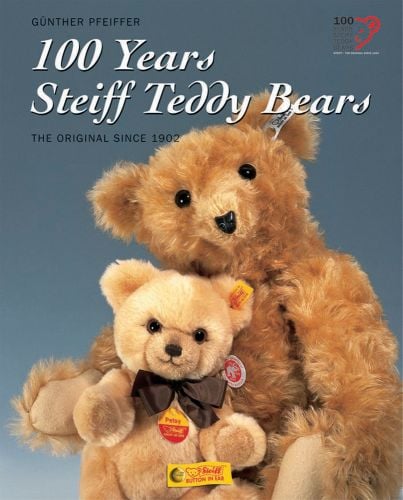 Book cover of 100 Years of Steiff Teddy Bears, The Original Since 1902, with two light brown Steiff bears, one with brown neck bow. Published by HEEL.