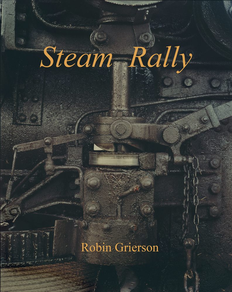 Steam engine mechanism covered in grease, on cover of 'Steam Rally, Robin Grierson', by Lost Press.