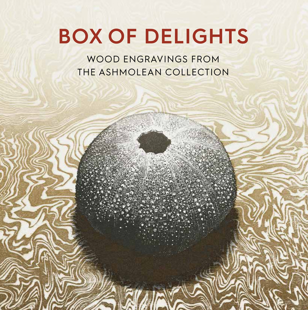 Round hollow wood carving with small surface pattern, on gold and white marbled cover of 'Box of Delights, Wood Engravings from the Ashmolean Collection', by Ashmolean Museum.