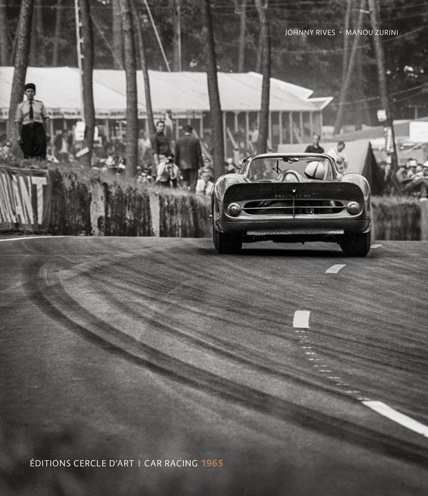 Black and white action photograph of a sports car on a sloped track with spectators on the side of the road with Johnny Rives Manou Zurini Editions Cercle D'Art Car Racing 1965 in white and beige