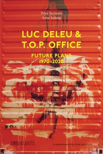 Red metal radiator daubed with off white and brown paint with Luc Deleu & T.O.P. office Future Plans 1970-2020 in yellow font