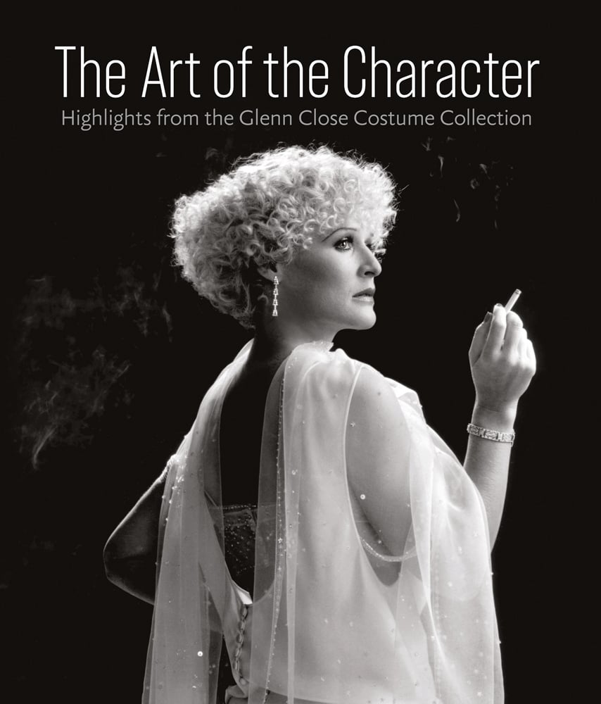 Glenn Close as Mandy Patinkin in Maxie (1985), in white draped dress, smoking, with The Art of the Character in white font above