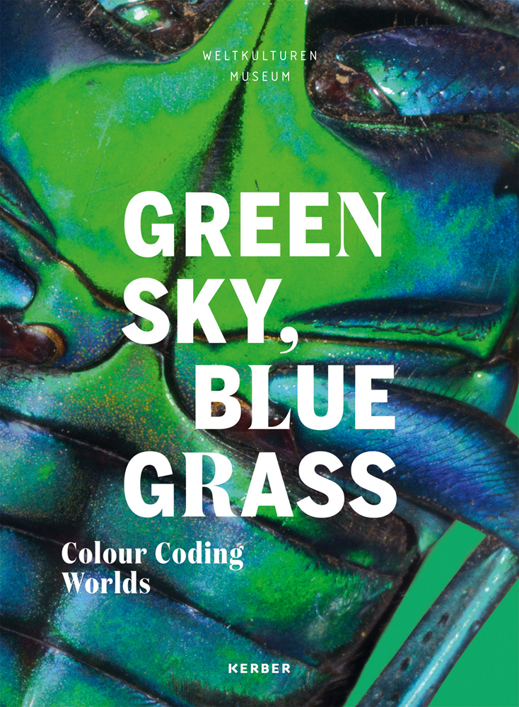 Close up of green and blue shimmery insect with Green Sky, Blue Grass Colour Coding Worlds in white font