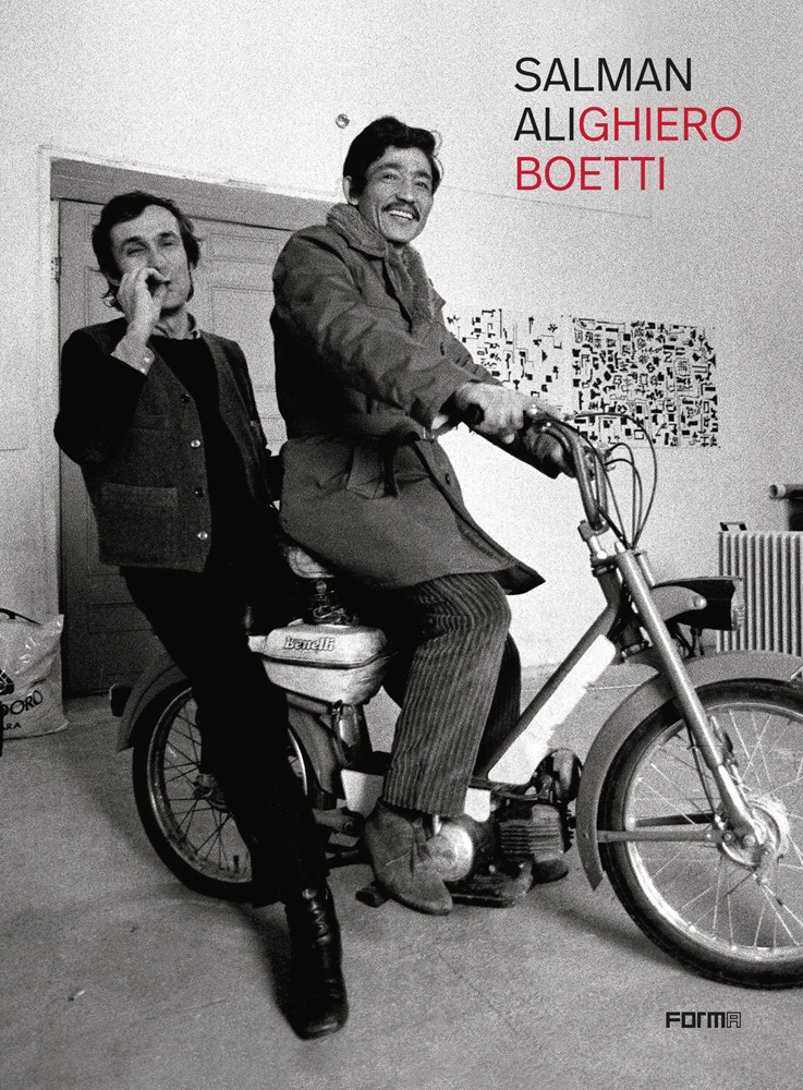 Salman Ali and Alighiero Boetti sitting on small motorcycle in art studio with Salman AliGhiero Boetti in black and pink font