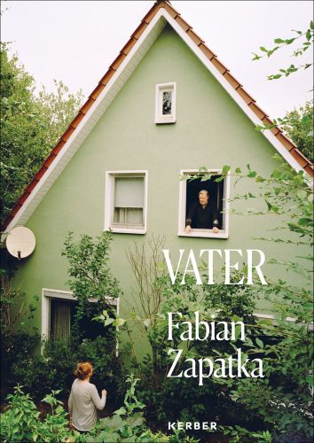 Mint green high pitched house with man standing at upper window talking to woman in garden below with Vater Fabian Zapatka in white font