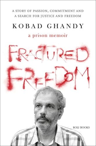 Head and shoulders photo of Kobad Ghandy in checked shirt with a prison memoir in red font and Fractured Freedom in red resembling blood