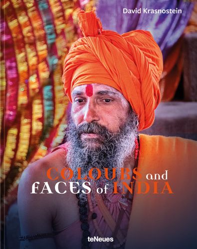 Indian man wearing an orange turban, tilaka mark to forehead, Colours and faces of India, in orange, and white font below.