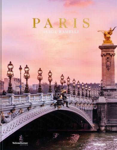 The Pont Alexandre III arch bridge over the Seine in Paris, pink sky, PARIS, in gold font above.