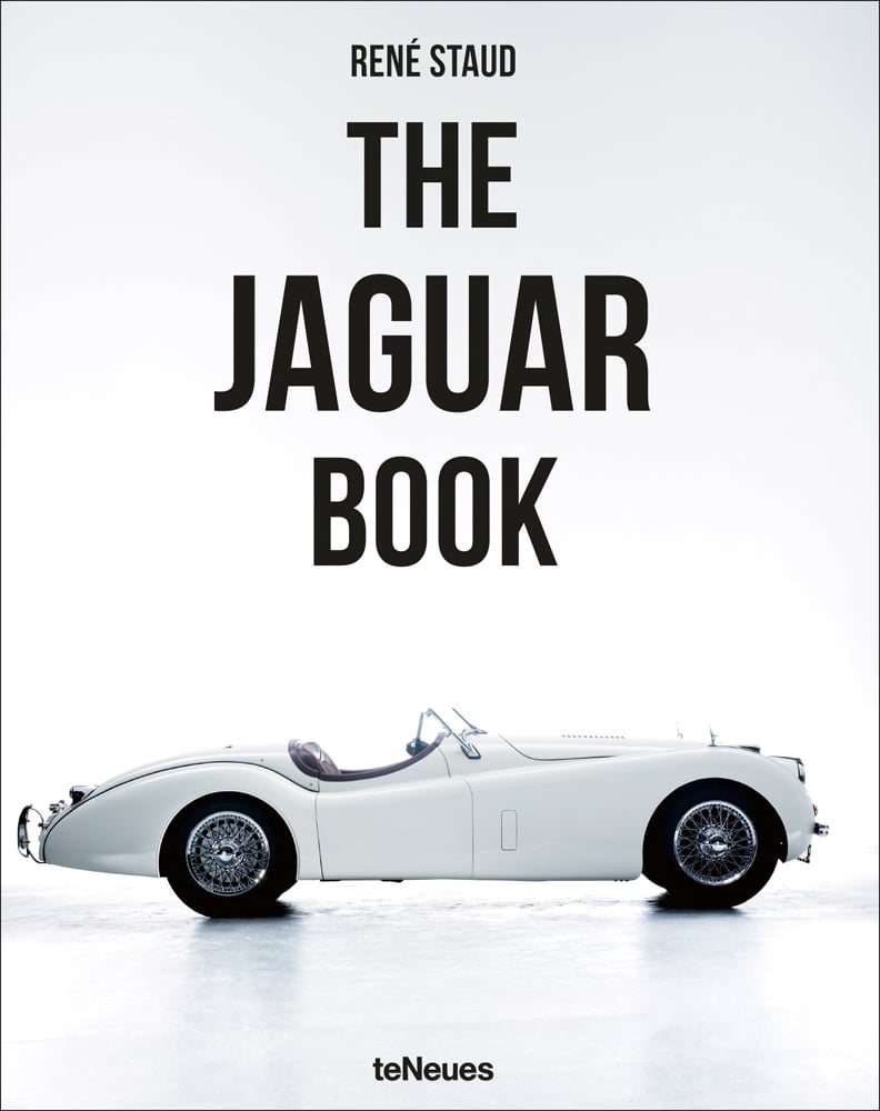 Cream Jaguar XK140 classic sports car with spoke wheels, The Jaguar Book, in black font above.