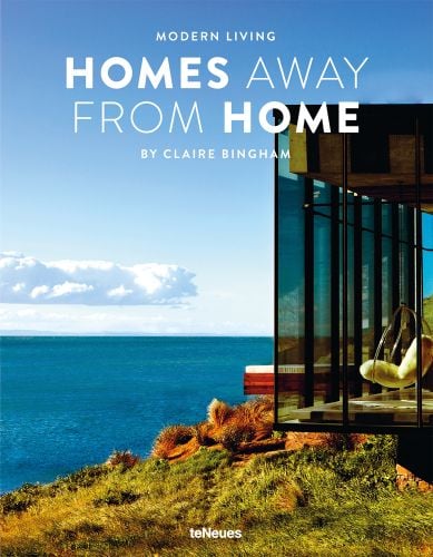 Glass holiday home by the sea, HOMES AWAY FROM HOME, in white font above.