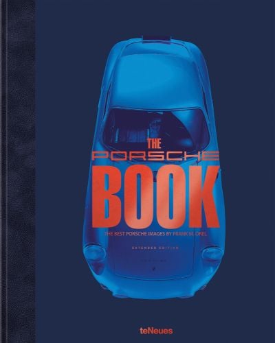 Aerial shot of Porsche model with blue filter, THE PORSCHE BOOK, in orange font to centre.