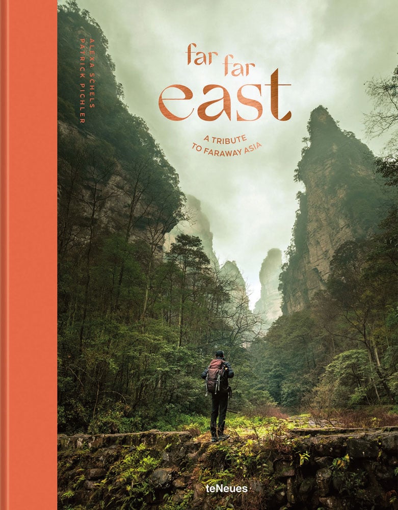 Asian mountain landscape looming over single backpacker with Far Far East in rich orange font above