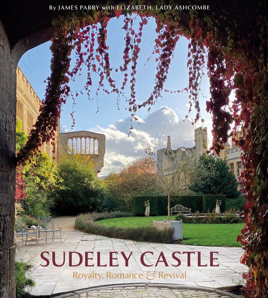 Obscured view of Sudeley Castle and grounds from underneath, arch covered in red and green ivy trails, Sudeley Castle in plum font