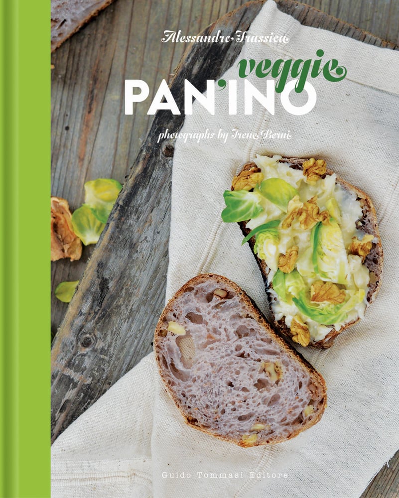 Panini with cheese, sprouts and walnuts on muslin with veggie PANINO in green and white font
