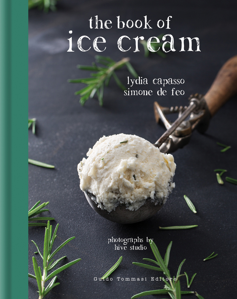 Scoop of pale ice cream, with sprigs of rosemary, and the book of ice cream in white font above