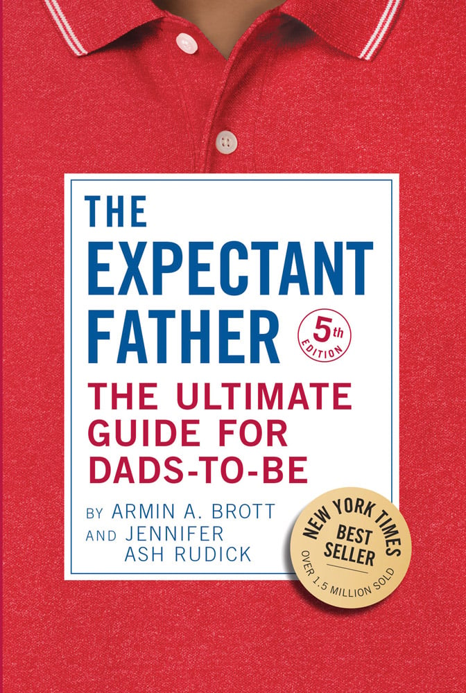 Close up of red polo shirt with collar and The Expectant Father The Ultimate Guide for Dads-to-Be in blue and red font on white oblong in centre