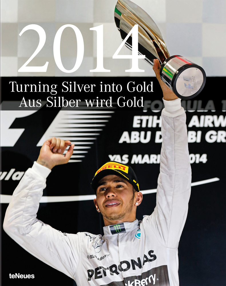 2014 Formula One World Champion Lewis Hamilton lifting the trophy, '2014, Turning Silver into Gold', in white font above.