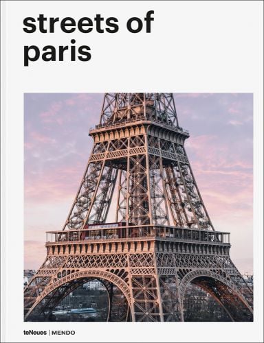 Close up centre section of Eiffel Tower, on white cover, streets of paris, is black font above.