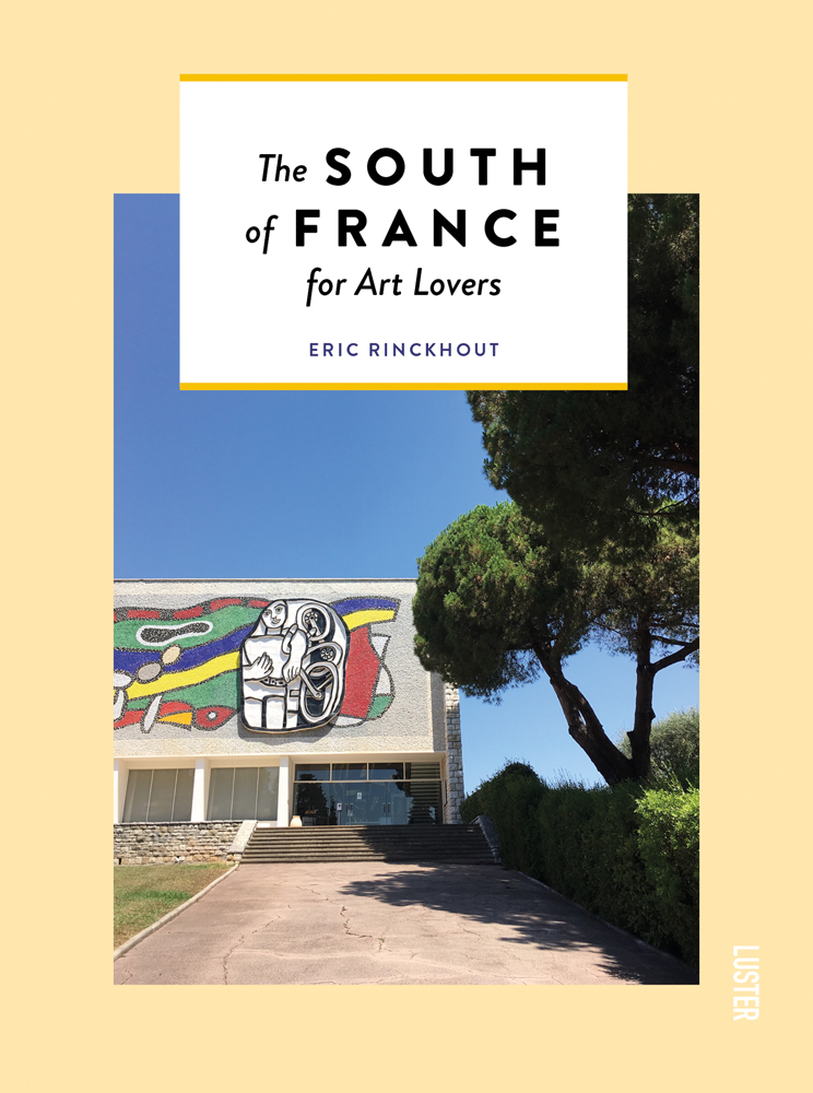 Graffitied building with cypress cloud tree, on pale yellow cover of 'The South of France for Art Lovers', by Luster Publishing.