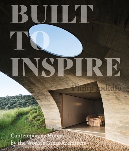 Book cover of Built to Inspire: Contemporary Homes by the World’s Great Architects, with a curved open structure with interior dining space and round sky light above. Published by Images Publishing.
