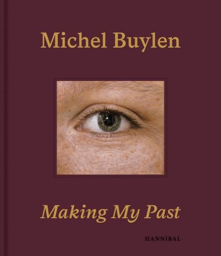 Hyper realistic painting of eye with sparse eyebrow, on maroon cover of 'Michel Buylen Making My Past', by Hannibal Books.