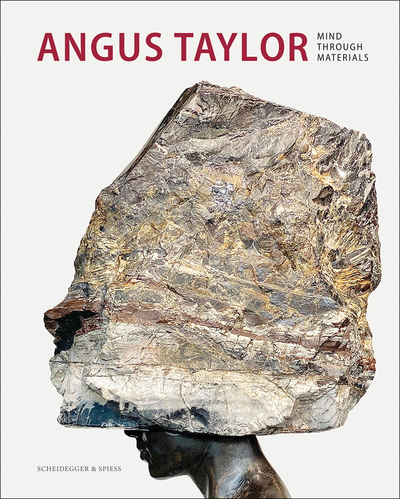 Large granite rock positioned over bronze head on white cover with Angus Taylor in red font above