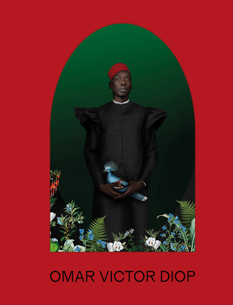 Red book cover of Omar Victor Diop, featuring a portrait photo of black man in black smock and red hat, holding blue exotic bird, titled 'Allegoria 1, 2021'. Published by 5 Continents Editions.