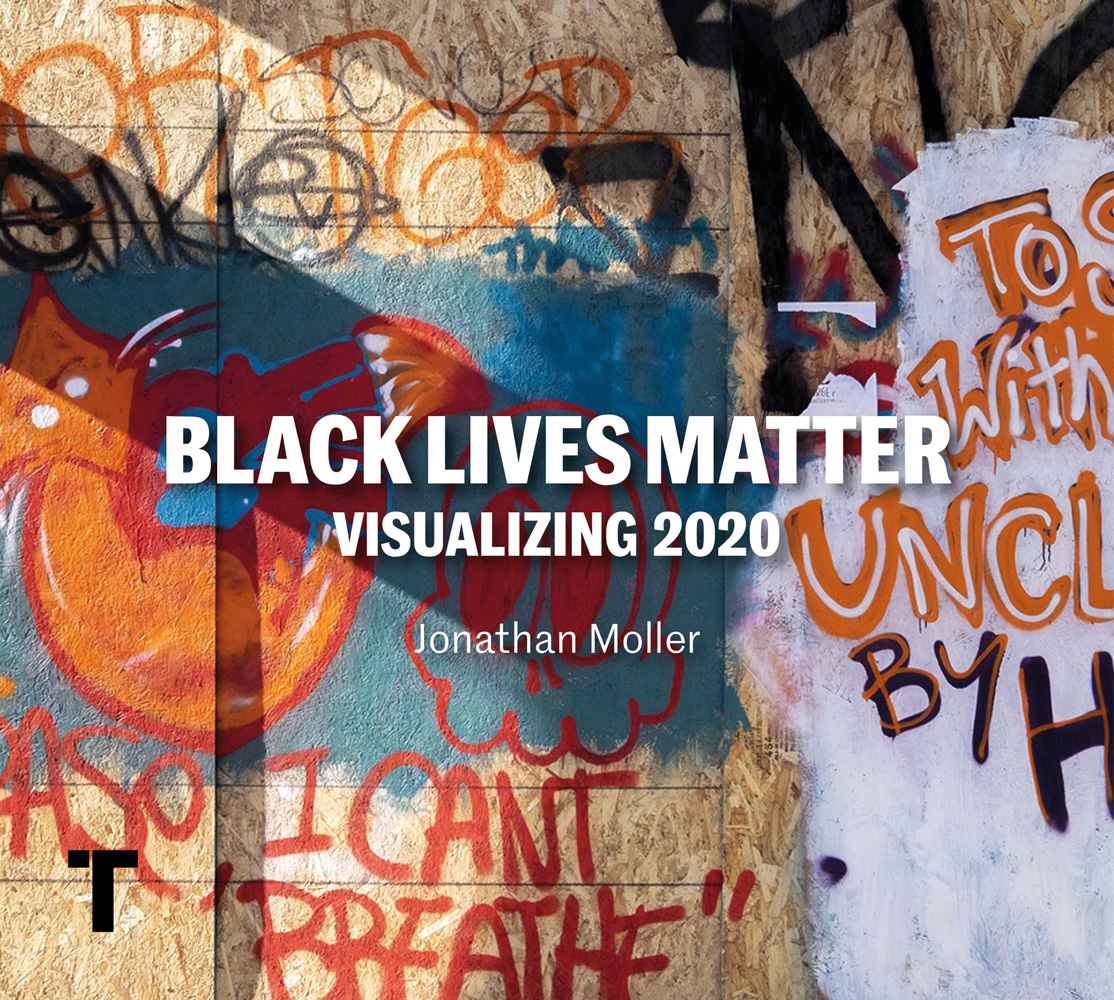 Chip board covered with graffiti art in orange and blue with Black Lives Matter Visualizing 2020 in white font