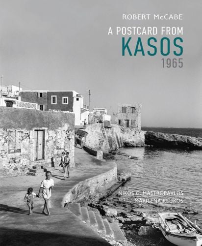 Kasos near waters edge, people walking down path next to stone buildings, Robert A. McCabe A Postcard from Kasos, 1965 in white turquoise and grey font to top right.