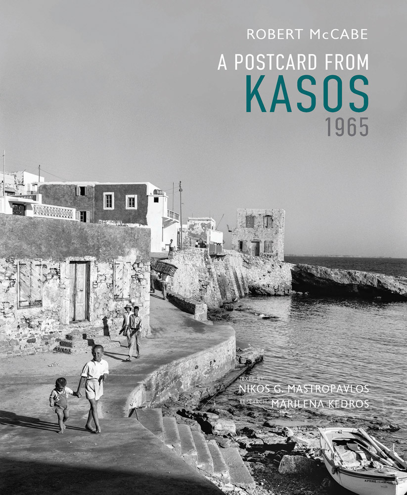 Sepia landscape of Kasos with sea to right and people walking down winding path next to stone buildings with Robert A. McCabe A Postcard from Kasos, 1965 in white turquoise and grey font