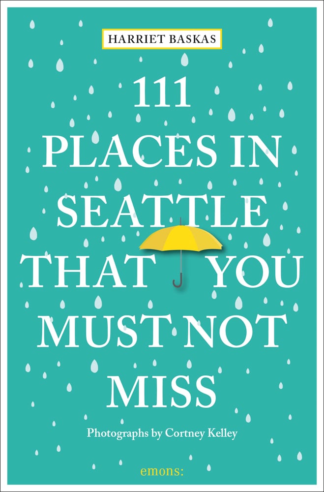 111 PLACES IN SEATTLE THAT YOU MUST NOT MISS in white font on green cover with white raindrops, yellow umbrella near centre.