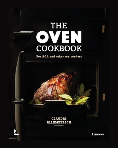 Black AGA oven door with cooked joint of meat and bay leaves in roasting tin and The Oven Cookbook in white font above
