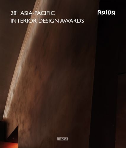 Close up dark interior image of wooden like structure with 28th Asia-Pacific Interior Design Awards in white capital letters above