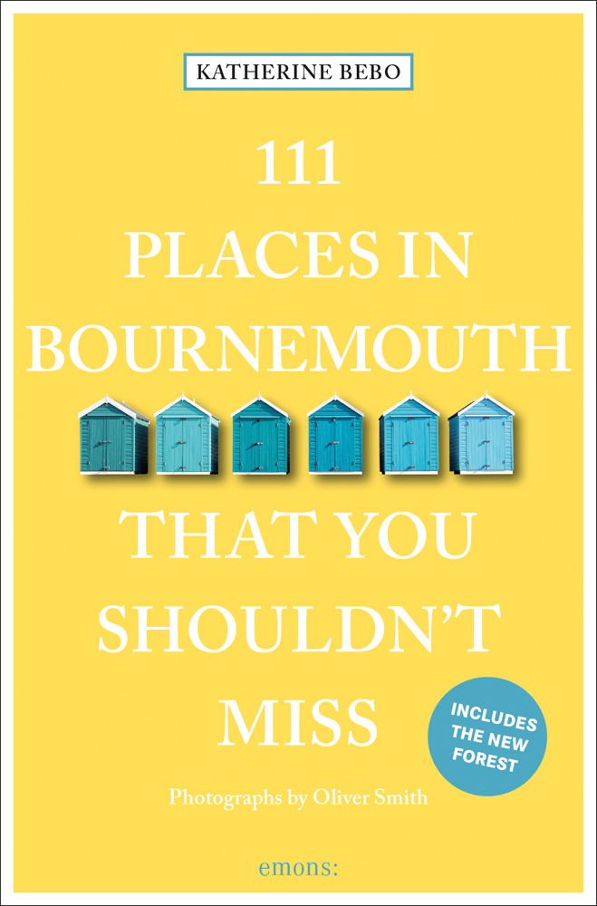 Row of beach huts to center of pale yellow cover of '111 Places in Bournemouth That You Shouldn't Miss', by Emons Verlag.