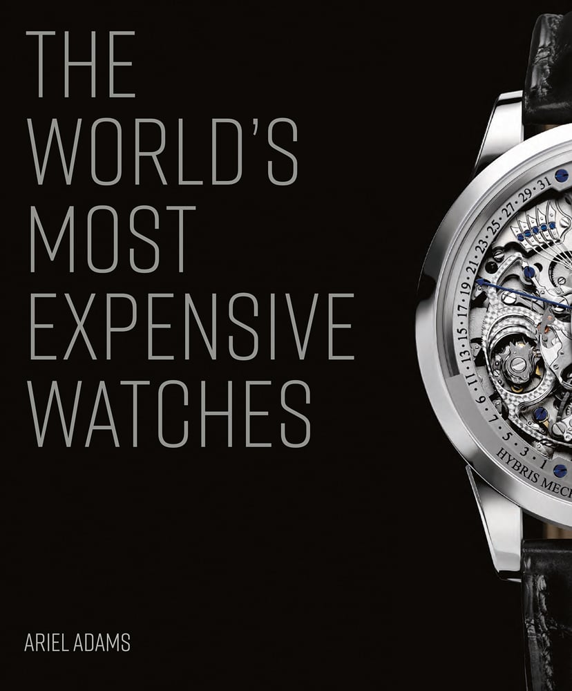 Luxury silver watch with exposed mechanism, black strap, to right edge, on black cover, THE WORLD'S MOST EXPENSIVE WATCHES in silver font to left.