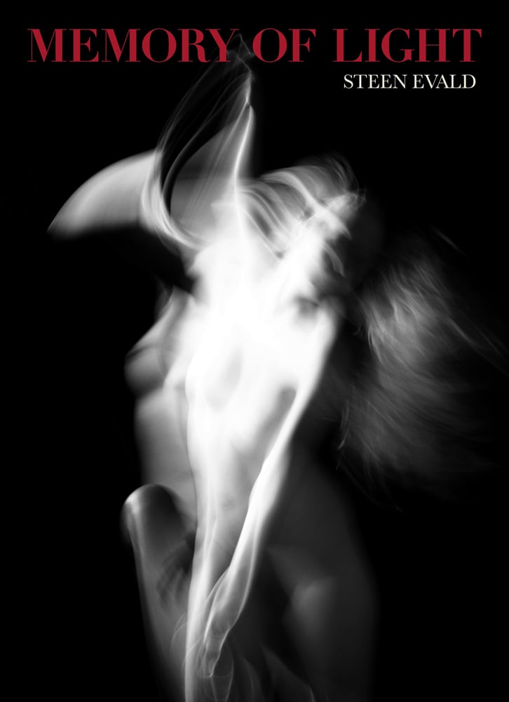 Black and white photograph of a three quarter length blurred female nude in movement with Memory of Light in red and Steen Evald in white by ACC Art Books