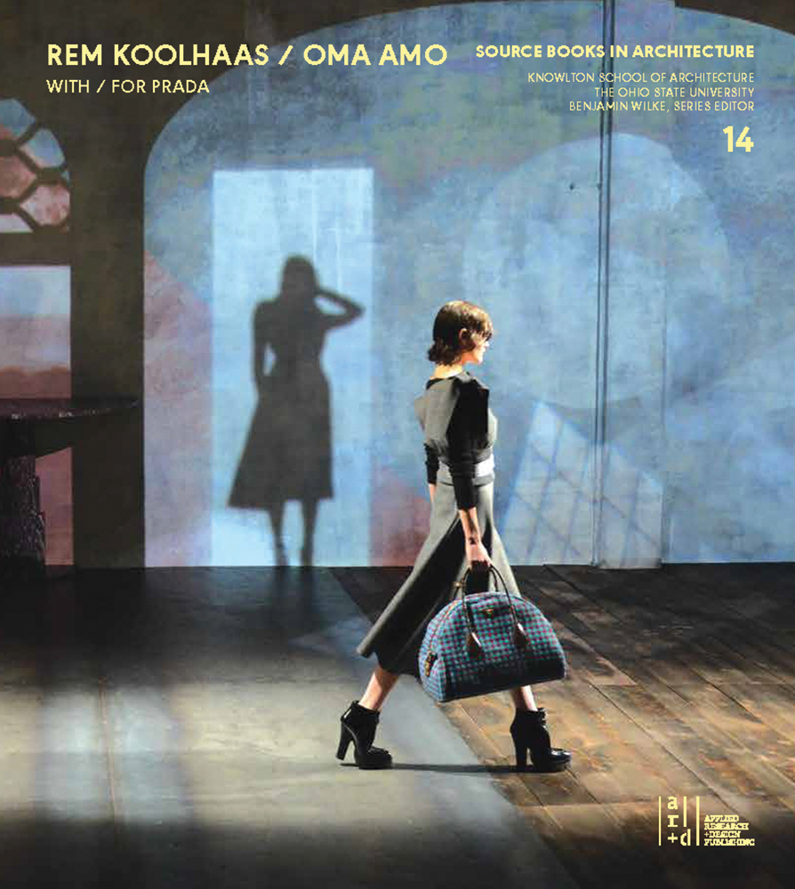 Catwalk model in heeled boots holding Prada bag with shadow of model on wall behind with Source Books in Architecture No. 14 in pale yellow font above