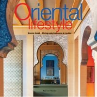 Oriental style interior with decorative door archways, on cover of 'Oriental Lifestyle', by Editions Norma.